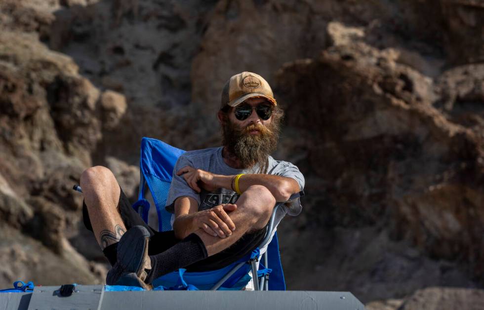 Poet and photographer Zack Wilfley sits atop his van and mobile home as he takes in the tempora ...