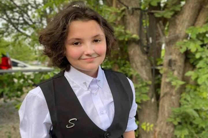 In this image provided Malia Pila, Nex Benedict poses outside the family's home in Owasso, Okla ...