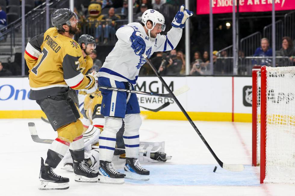 Vegas Golden Knights defenseman Alex Pietrangelo (7) reacts while Toronto Maple Leafs center Au ...