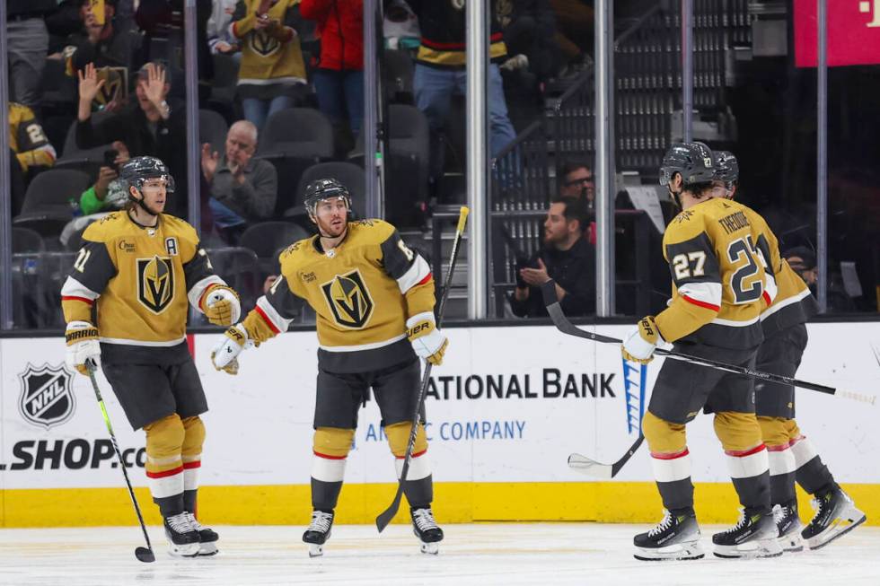 Vegas Golden Knights center William Karlsson, left, celebrates with right wing Jonathan Marches ...
