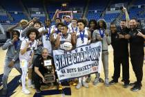 The Sierra Vista boys basketball team celebrates after winning the Class 4A state championship ...