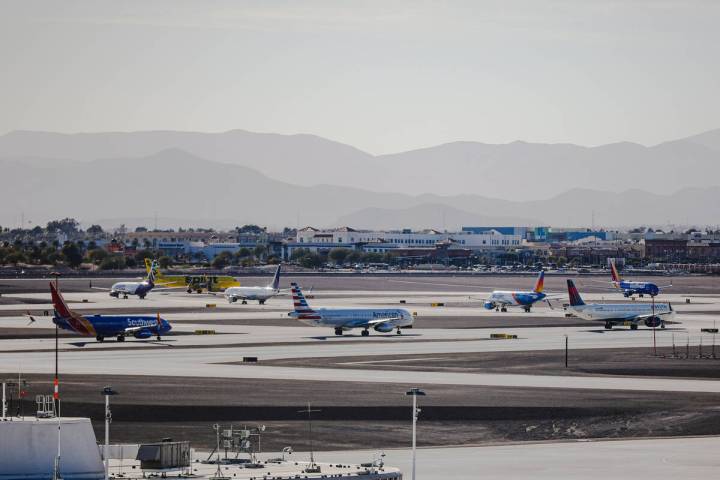 Planes wait in a line to take off on the tarmac at Harry Reid International Airport in Las Vega ...