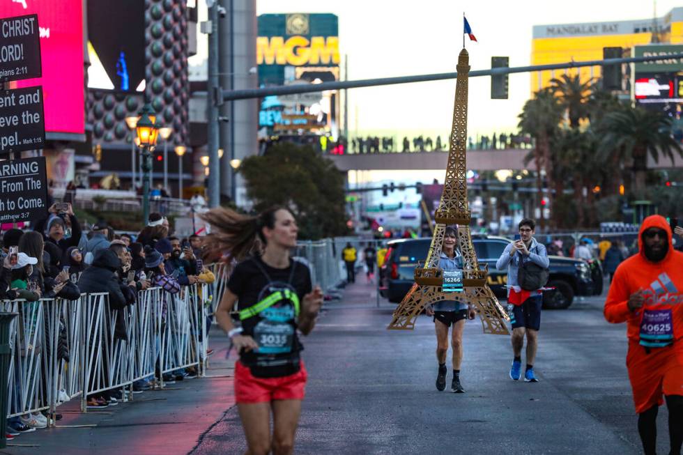 A man dressed as the Eiffel Tower races in the Rock ’n’ Roll Running Series Racin ...