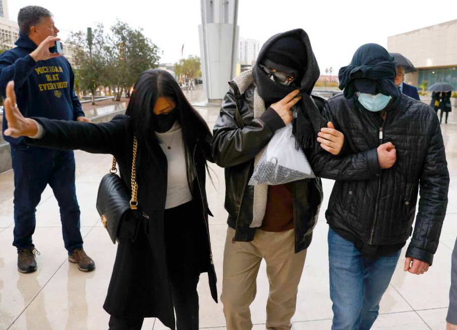 FILE - Former FBI informant Alexander Smirnov, second from right, leaves the courthouse on Feb. ...