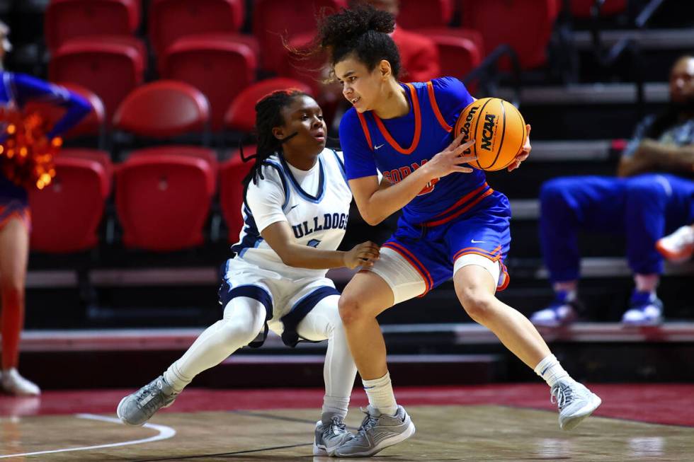 Bishop Gorman's Aaliah Spaight (10) dribbles against Centennial's Tessa Prince (3) during the s ...