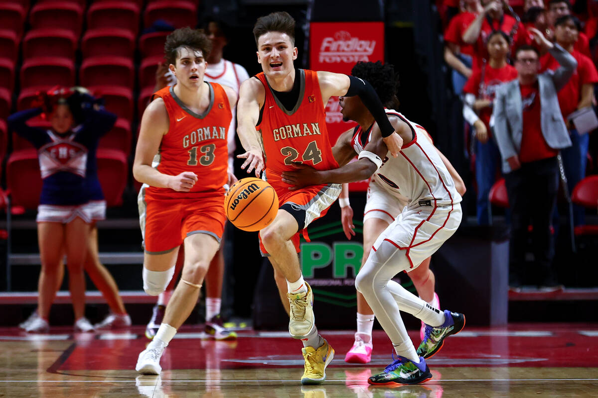 Bishop Gorman's Ryder Elisaldez (24) dribbles up the court while drawing a foul from Coronado's ...