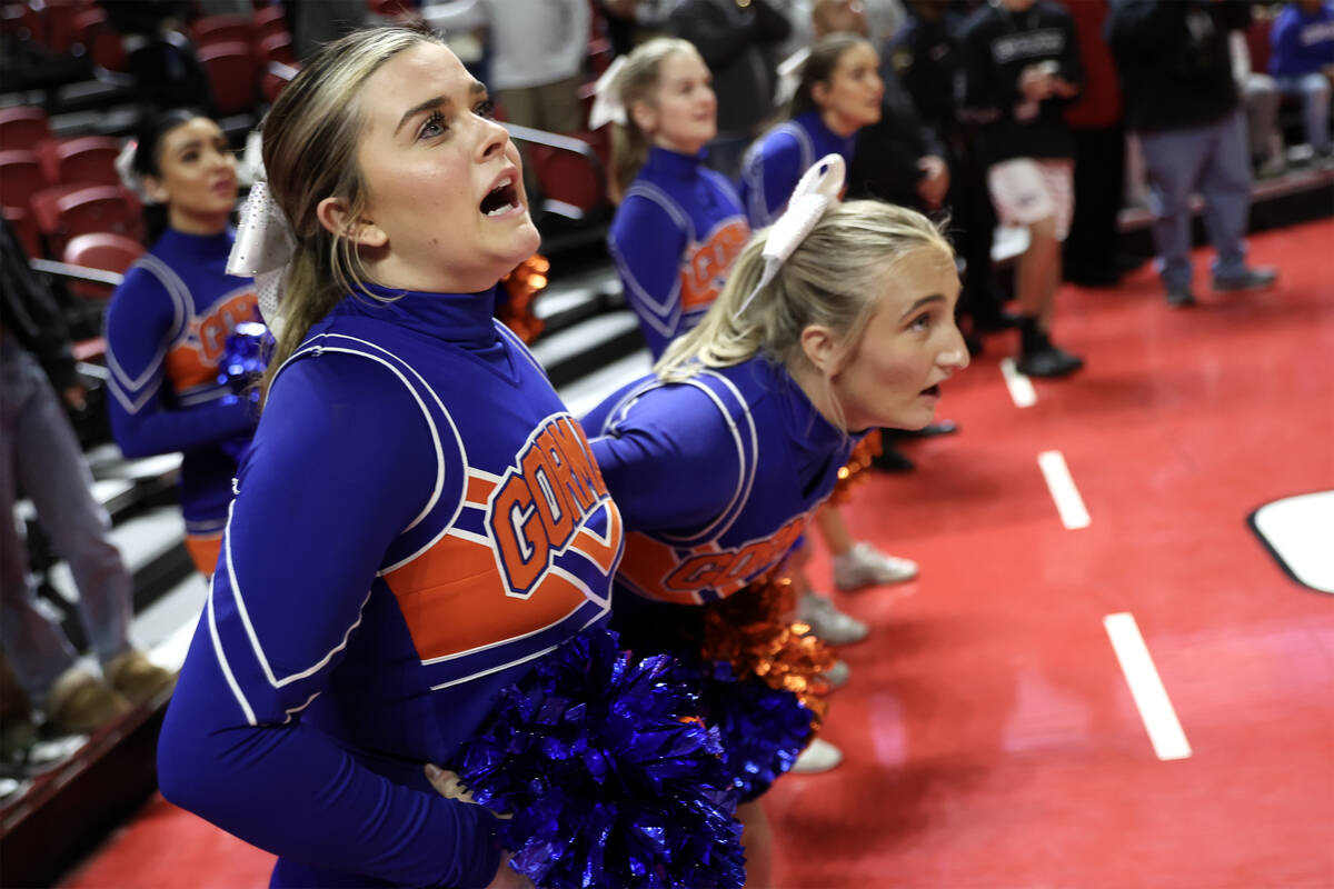 Bishop Gorman cheerleaders anticipate a free throw during the second half of the Class 5A boys ...