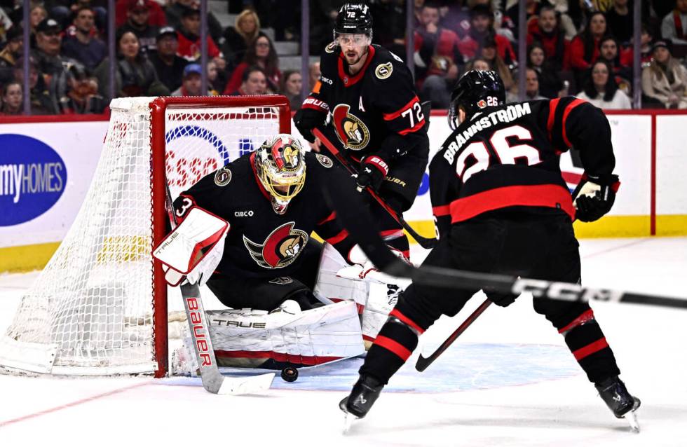 Ottawa Senators goaltender Anton Forsberg (31) settles a bouncing puck during the first period ...