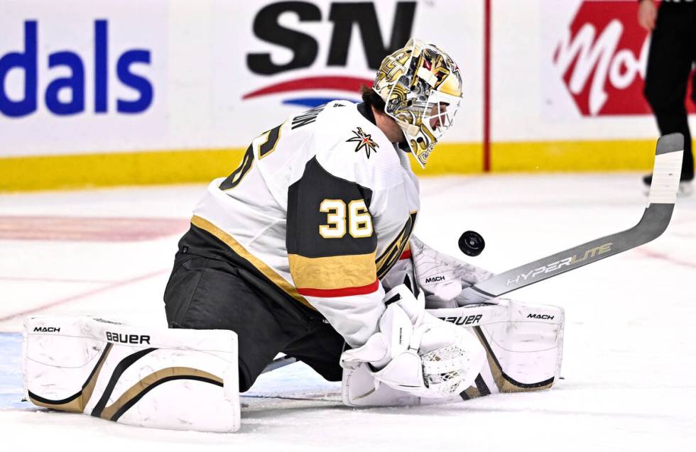 Vegas Golden Knights goaltender Logan Thompson watches the bouncing puck during the second peri ...