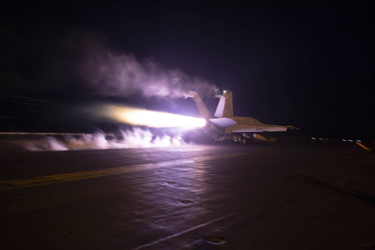 This image provided by the U.S. Navy shows an aircraft launching from USS Dwight D. Eisenhower ...