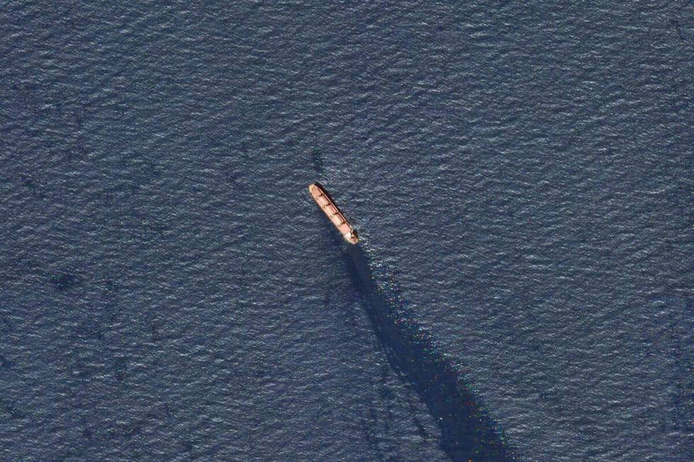 In this satellite image provided by Planet Labs, the Belize-flagged bulk carrier Rubymar is see ...