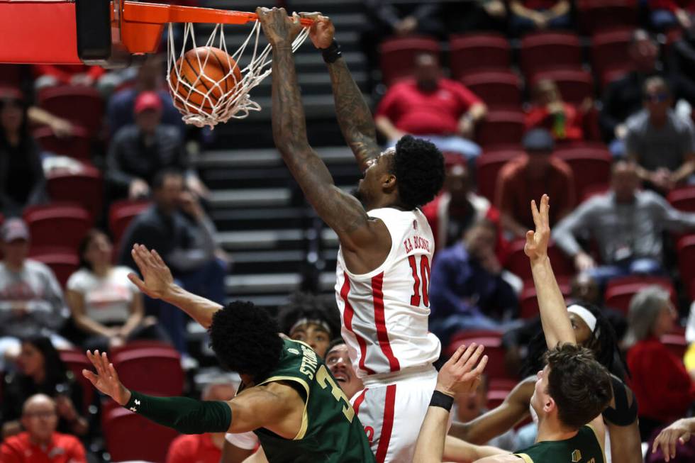 UNLV Rebels forward Kalib Boone (10) drunks on the Colorado State Rams during the first half of ...