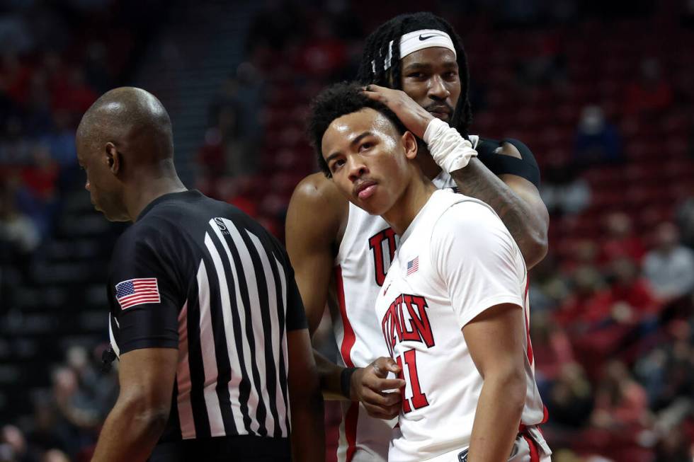 UNLV Rebels forward Keylan Boone (20) embraces guard Dedan Thomas Jr. (11) during the second ha ...