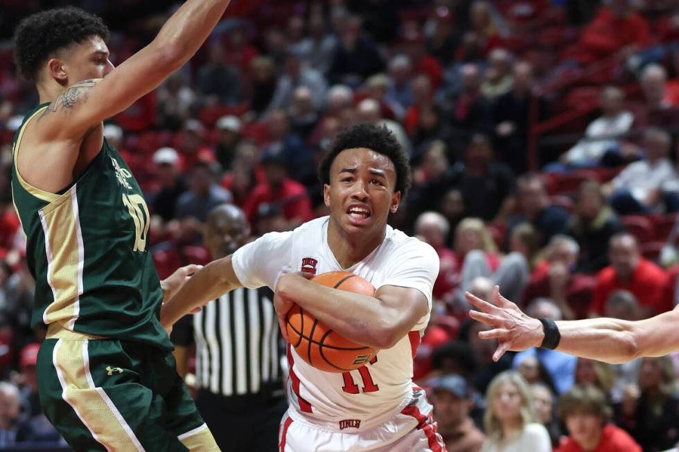 UNLV Rebels guard Dedan Thomas Jr. (11) drives toward the hoop against Colorado State Rams guar ...