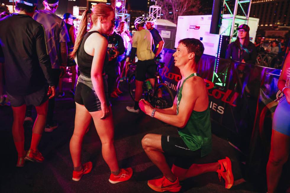 Mackenzie Mettille, right, proposes to his girlfriend, Courtney Clark, after running in the Roc ...