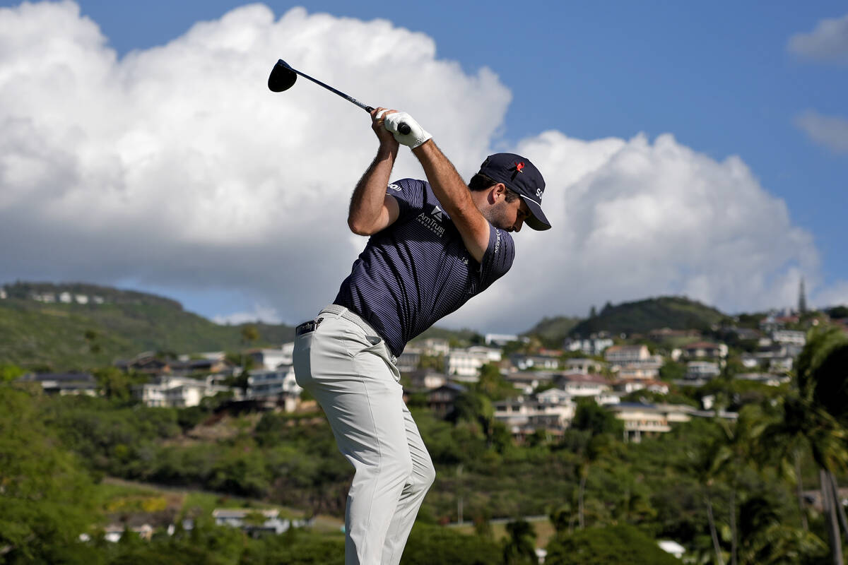 Taylor Montgomery hits from the 14th tee during the first round of the Sony Open in Hawaii, Thu ...