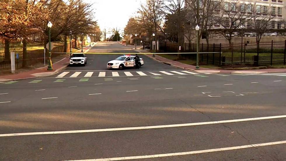 In this image taken from video, police are deployed outside the Israeli Embassy in Washington, ...