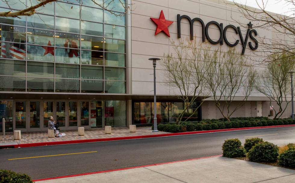 An elderly shopper sits outside of the Macy's store in Downtown Summerlin in 2020 in Las Vegas. ...