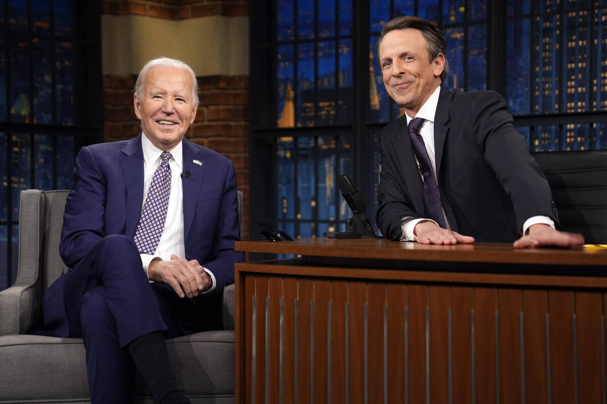 President Joe Biden talks with Seth Meyers during a taping of the "Late Night with Seth Me ...