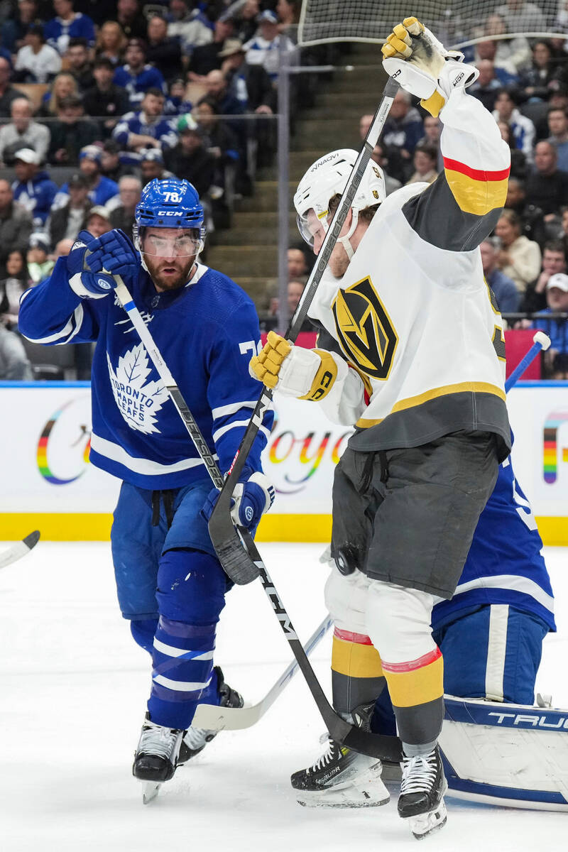 Vegas Golden Knights' Sheldon Rempal, right, tries to tip the puck past Toronto Maple Leafs goa ...