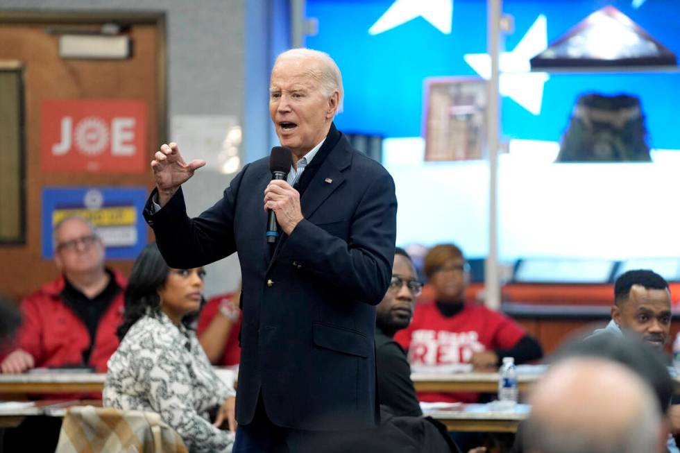 FILE - President Joe Biden meets with UAW members during a campaign stop at a phone bank in the ...