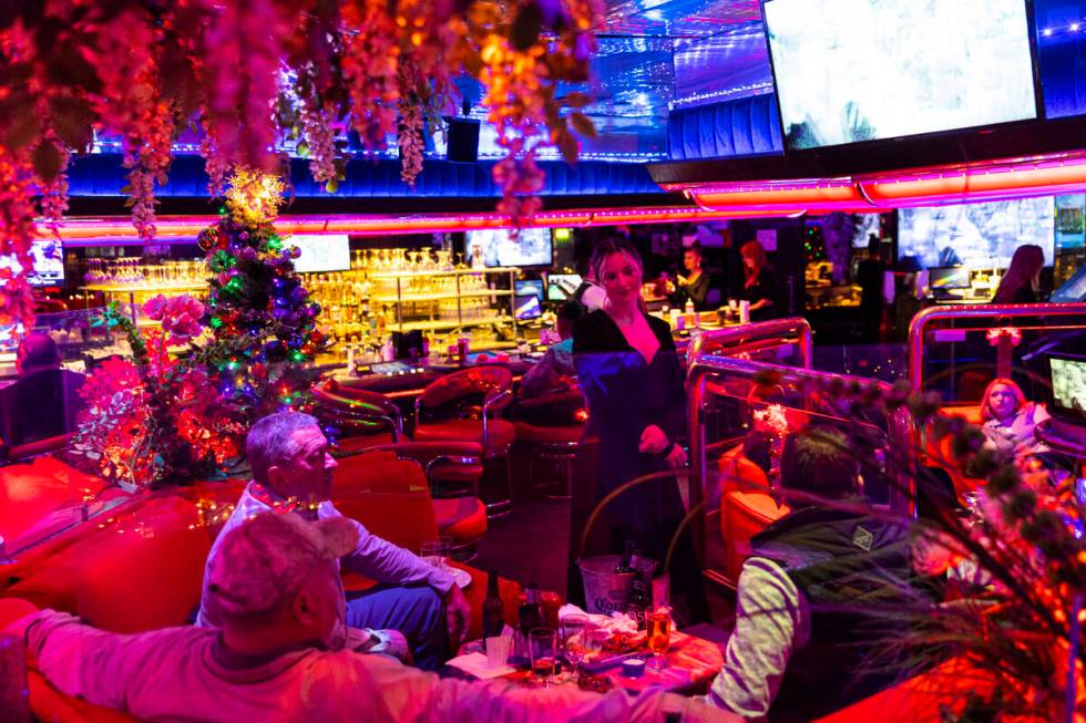 Cocktail waitress Behati Perry checks in with patrons in the Fireside Lounge at Peppermill on T ...