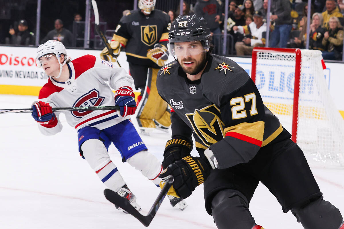 Golden Knights defenseman Shea Theodore (27) skates down the rink during an NHL game against th ...