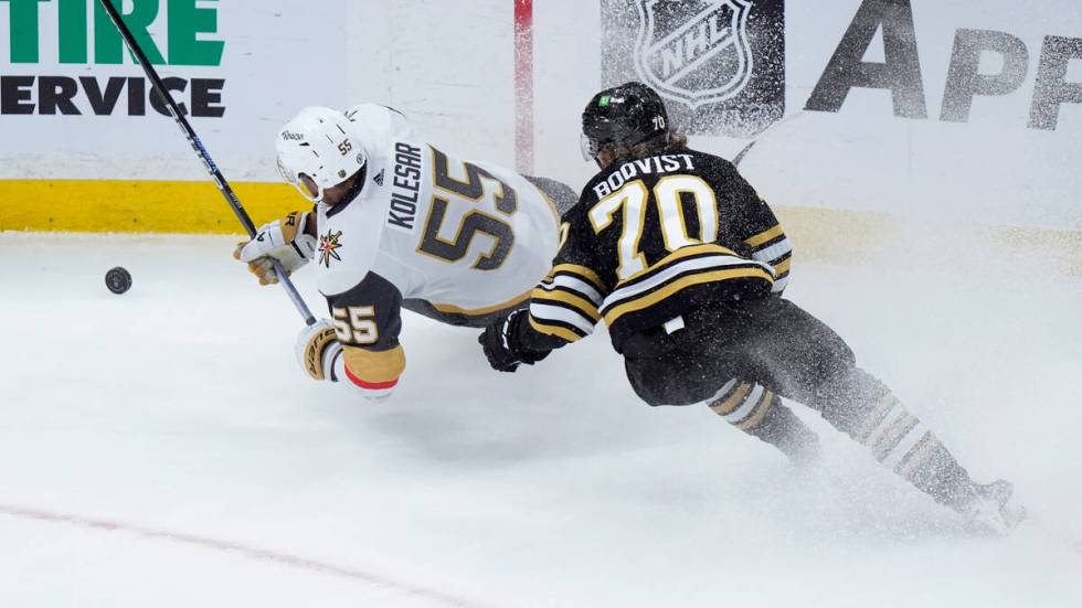 Vegas Golden Knights right wing Keegan Kolesar (55) and Boston Bruins center Jesper Boqvist (70 ...