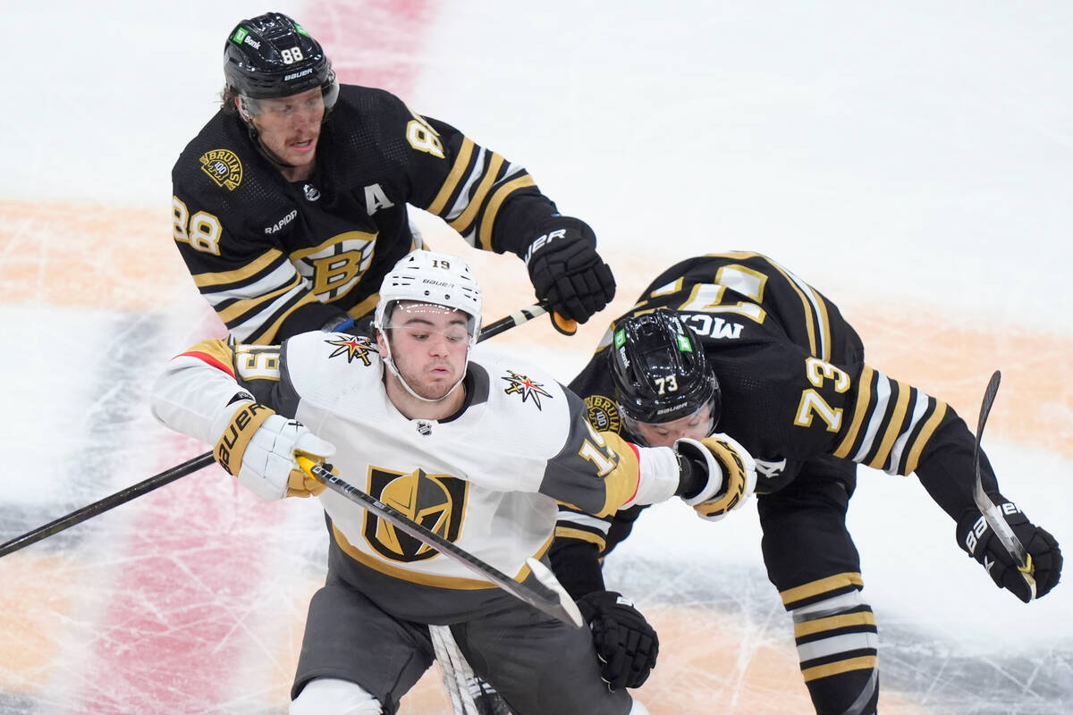 Vegas Golden Knights center Brendan Brisson (19) vies for position with Boston Bruins right win ...