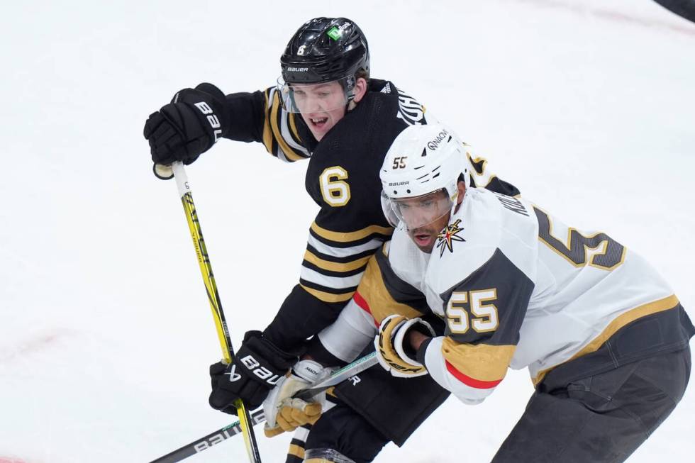 Boston Bruins defenseman Mason Lohrei (6) and Vegas Golden Knights right wing Keegan Kolesar (5 ...