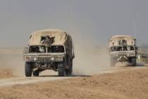 Israeli IDF vehicles move a long the border with the Gaza Strip on Feb. 28, 2024, in Southern i ...