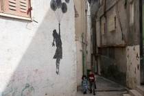 Palestinian children walk in an alley of the Aida Refugee Camp, near the health clinic and scho ...