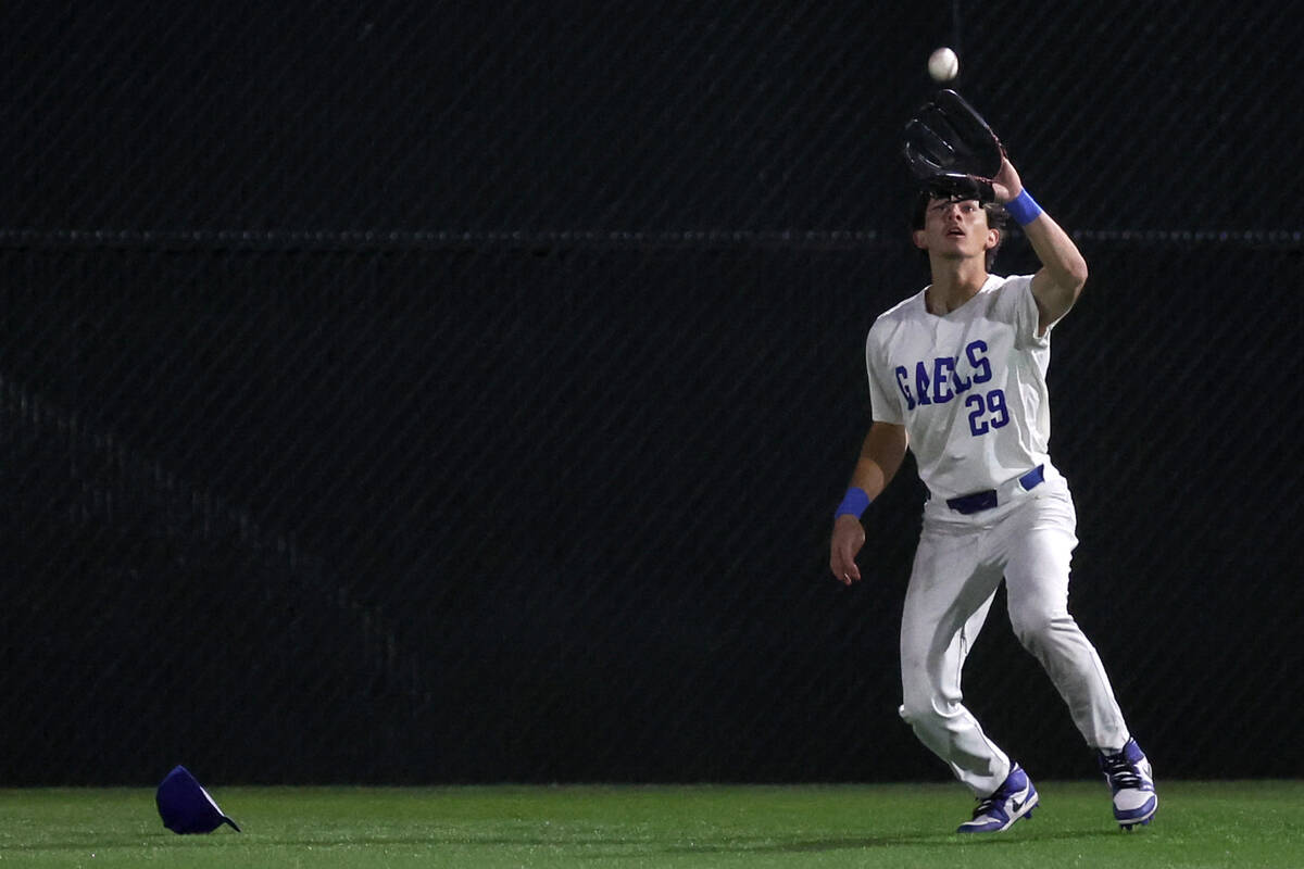 Bishop Gorman outfielder Drake Kajioka catches for an out over Basic during a high school baseb ...