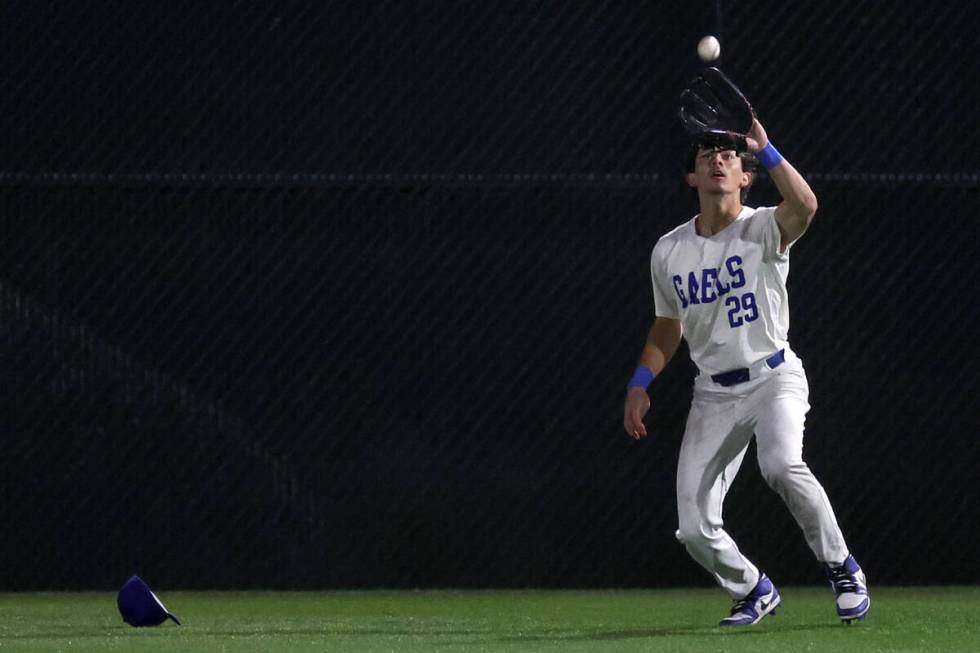 Bishop Gorman outfielder Drake Kajioka catches for an out over Basic during a high school baseb ...
