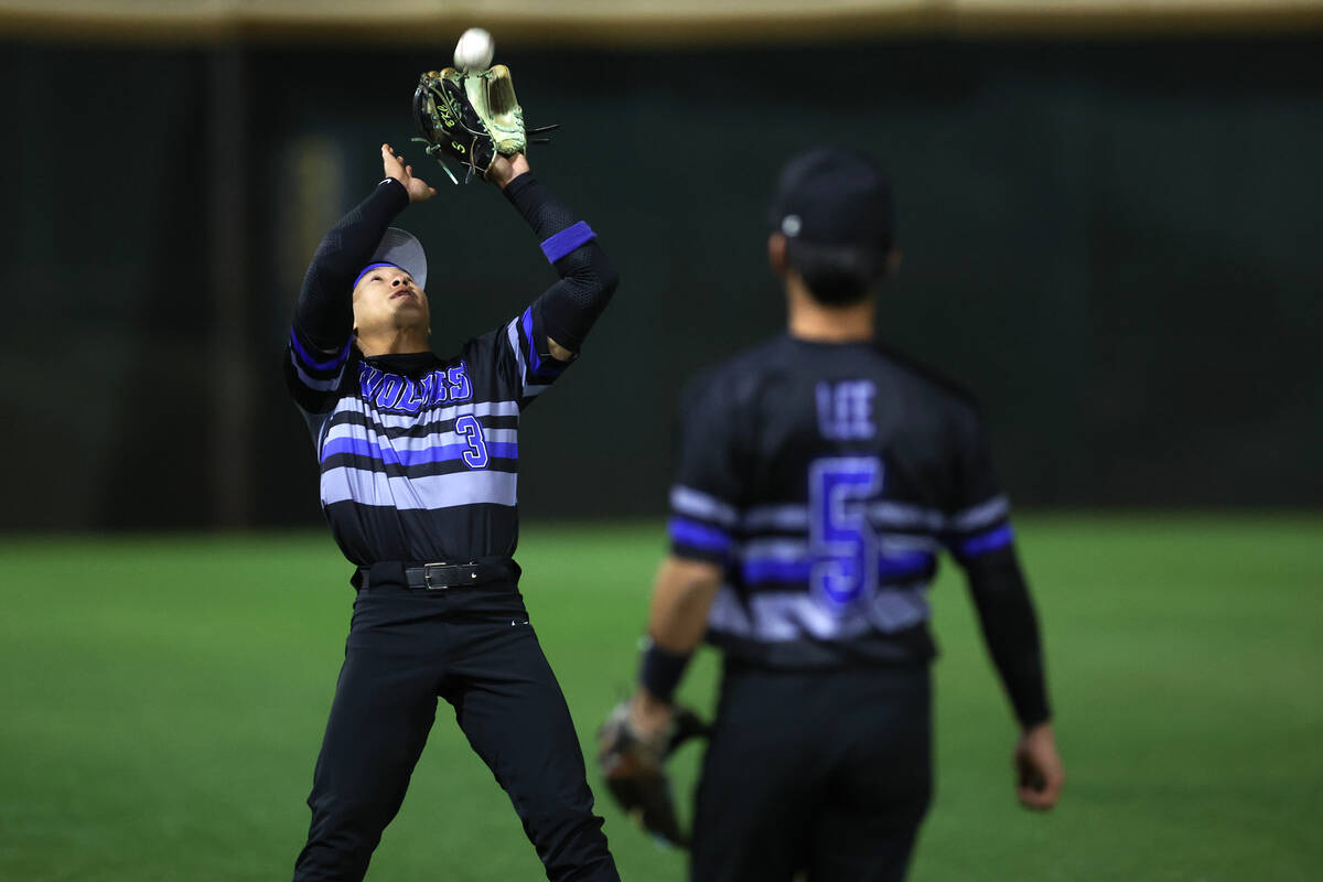 Basic short stop Ty Southisene (3) catches for an out over Bishop Gorman during a high school b ...