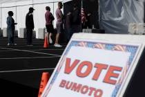 Voters wait in line to cast ballots Friday, Nov. 4, 2022, at Silverado Ranch Plaza in Henderson ...