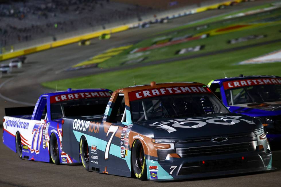 Kyle Busch (71) closely leads Rajah Caruth (71) during the Victoria's Voice Foundation 200 NASC ...