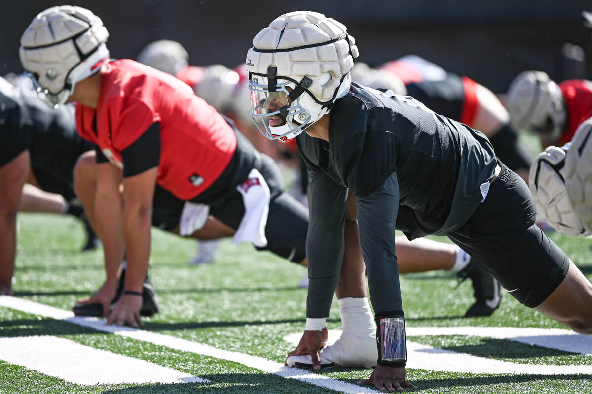 UNLV quarterback Hajj-Malik Williams stretches during the first day of spring practice Saturday ...