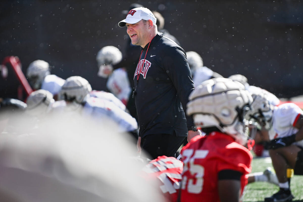 UNLV football head coach Barry Odom watches his team on the first day of practice Saturday, Mar ...