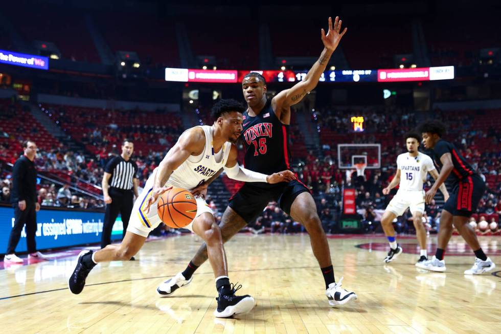 San Jose State Spartans guard Myron Amey Jr. (0) drives toward the hoop while UNLV Rebels guard ...