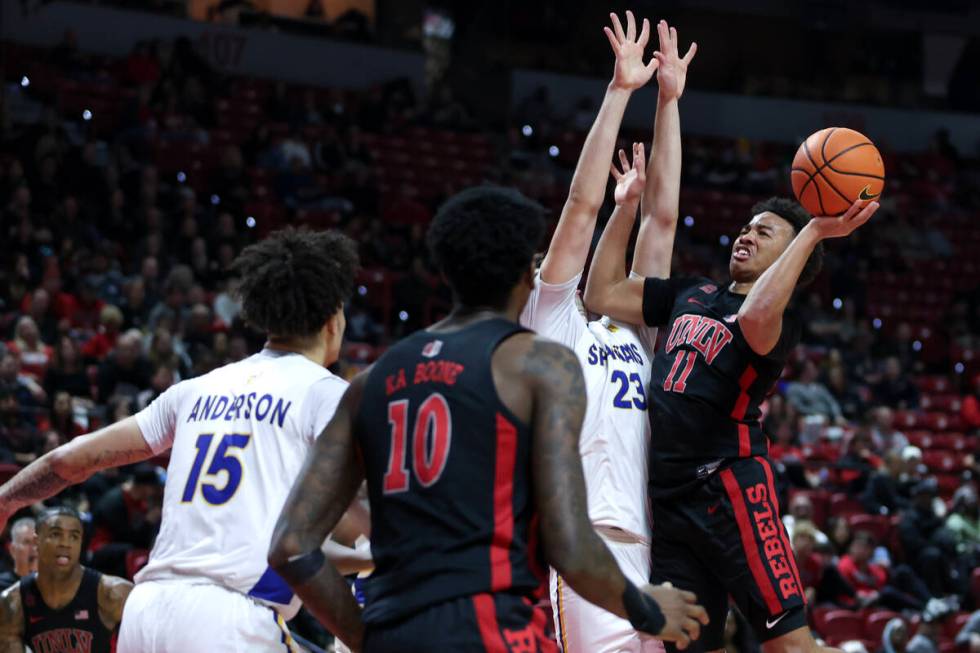 UNLV Rebels guard Dedan Thomas Jr. (11) shoots against San Jose State Spartans forward Diogo Se ...