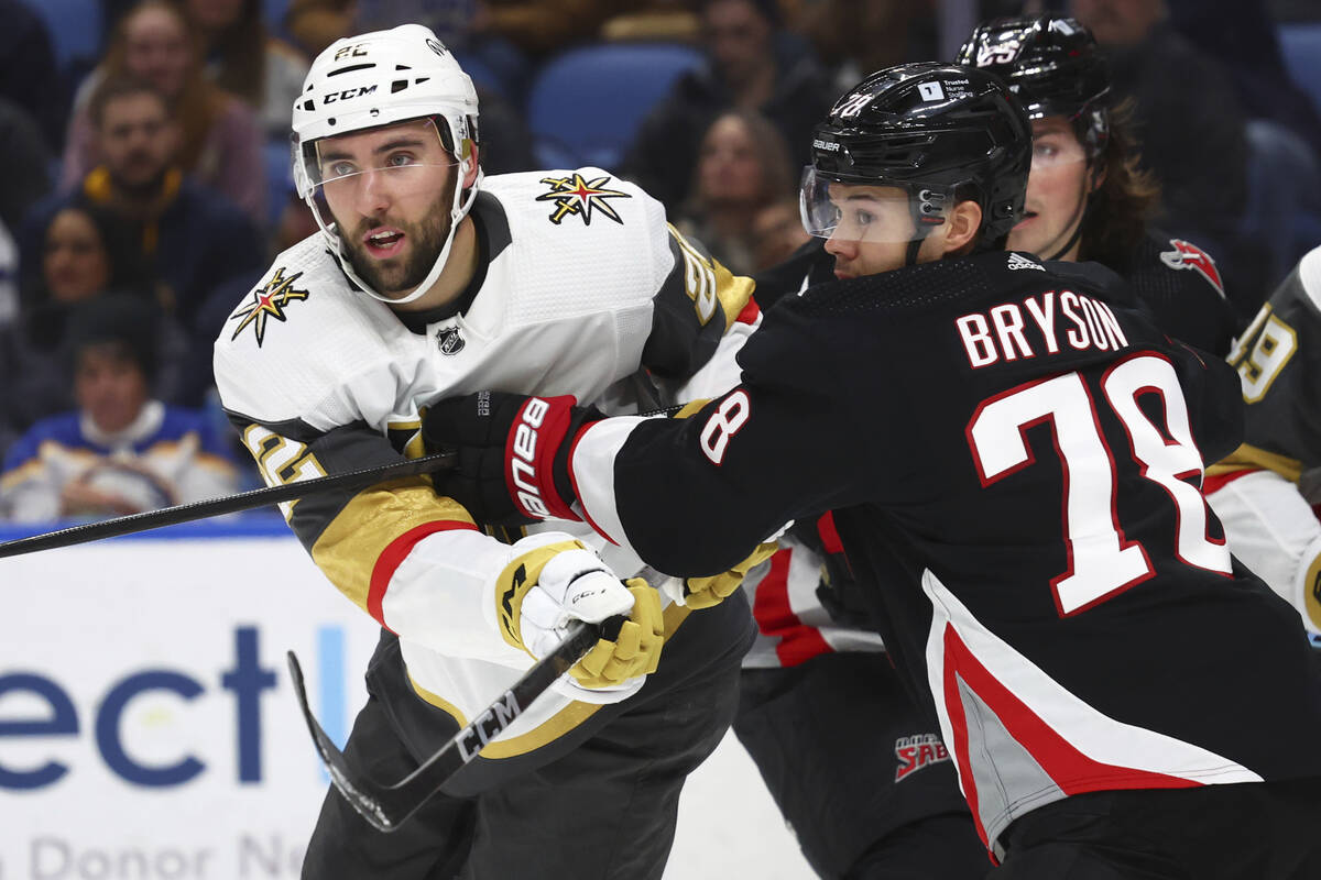 Vegas Golden Knights right wing Michael Amadio (22) and Buffalo Sabres defenseman Jacob Bryson ...