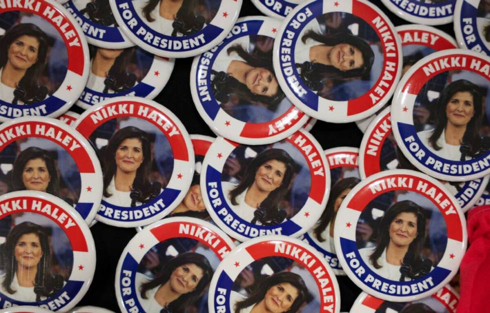 Buttons promoting Nikki Haley lie on a table at a campaign event in Portland, Maine, Sunday, Ma ...