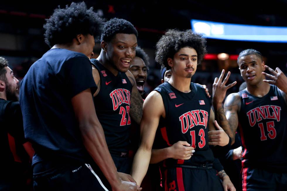 UNLV Rebels guard Brooklyn Hicks (13) falls back into the bench after scoring a three-pointer d ...