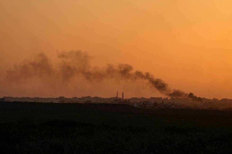 Smoke rises following an explosion in the Gaza Strip as seen from southern Israel, Monday, Marc ...