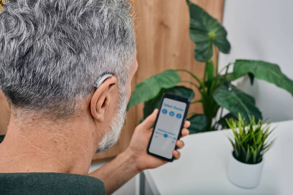 Using a smartphone app to change volume and other hearing aid settings can be much easier than ...