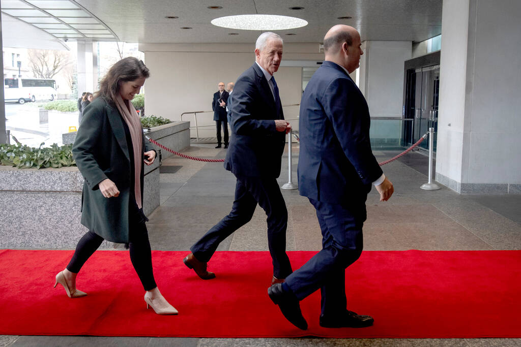 Benny Gantz, center, a key member of Israel's War Cabinet and the top political rival of Israel ...