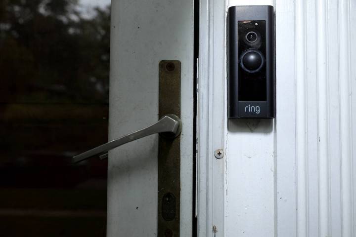A doorbell device with a built-in camera made by home security company Ring is seen on Aug. 28, ...