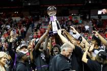 San Diego State players and coach Brian Dutcher, front center, celebrate their victory over Uta ...