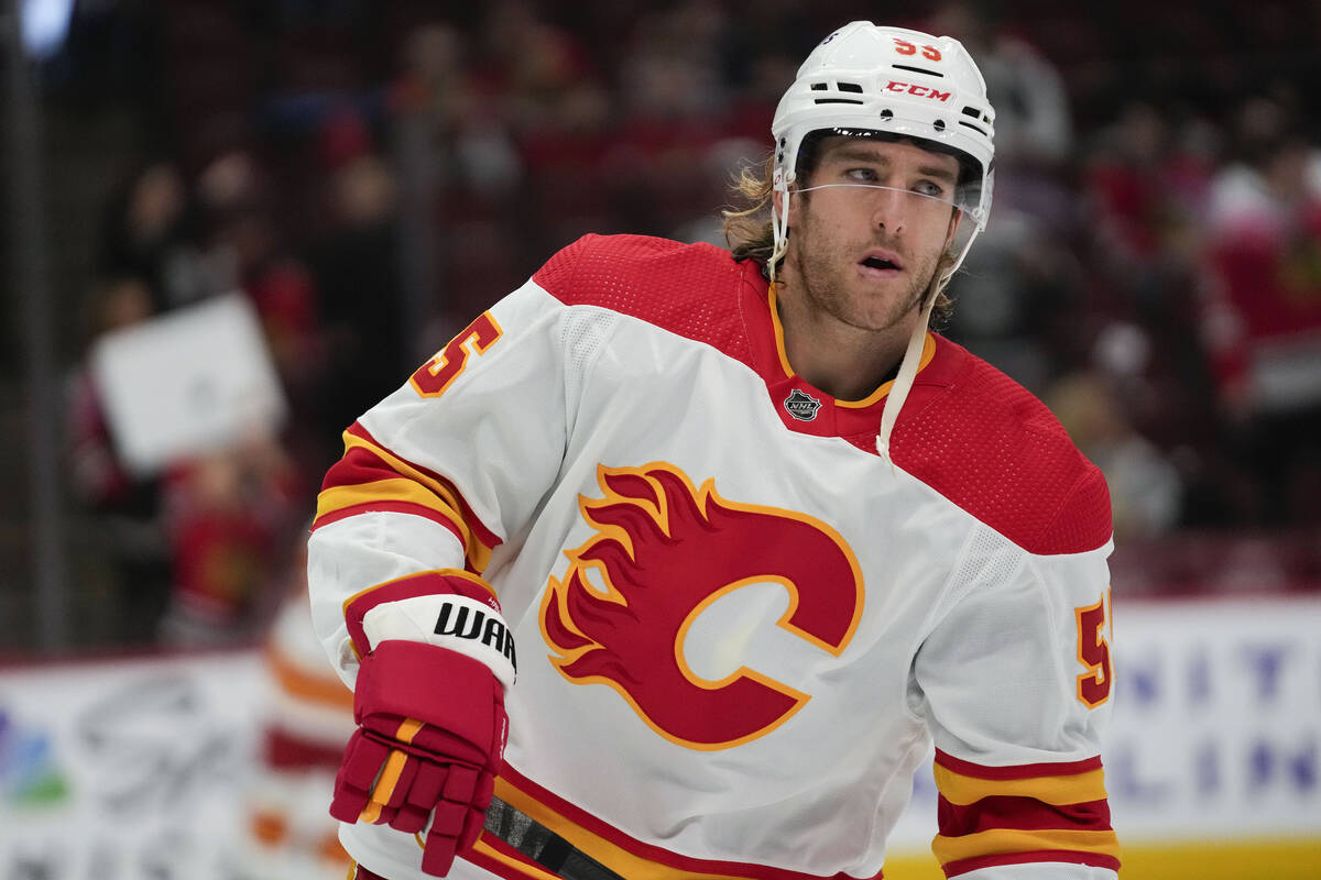 Calgary Flames defenseman Noah Hanifin warms up before an NHL hockey game against the Chicago B ...